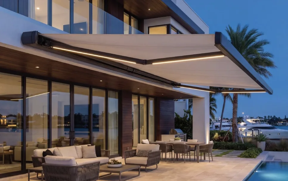 Full cassette retractable awning with LED lighting on luxury waterfront home